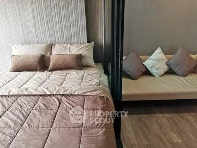 Modern bedroom with cozy bed and stylish decor in a contemporary apartment.