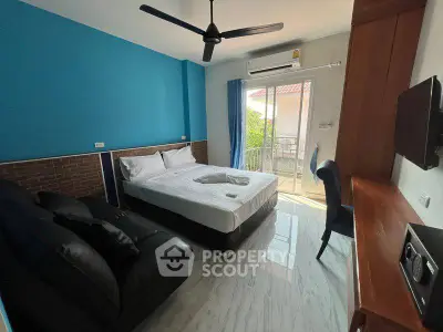 Modern bedroom with balcony access and stylish decor