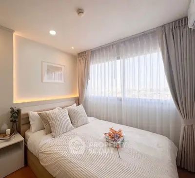 Bright and cozy bedroom with large window and elegant decor