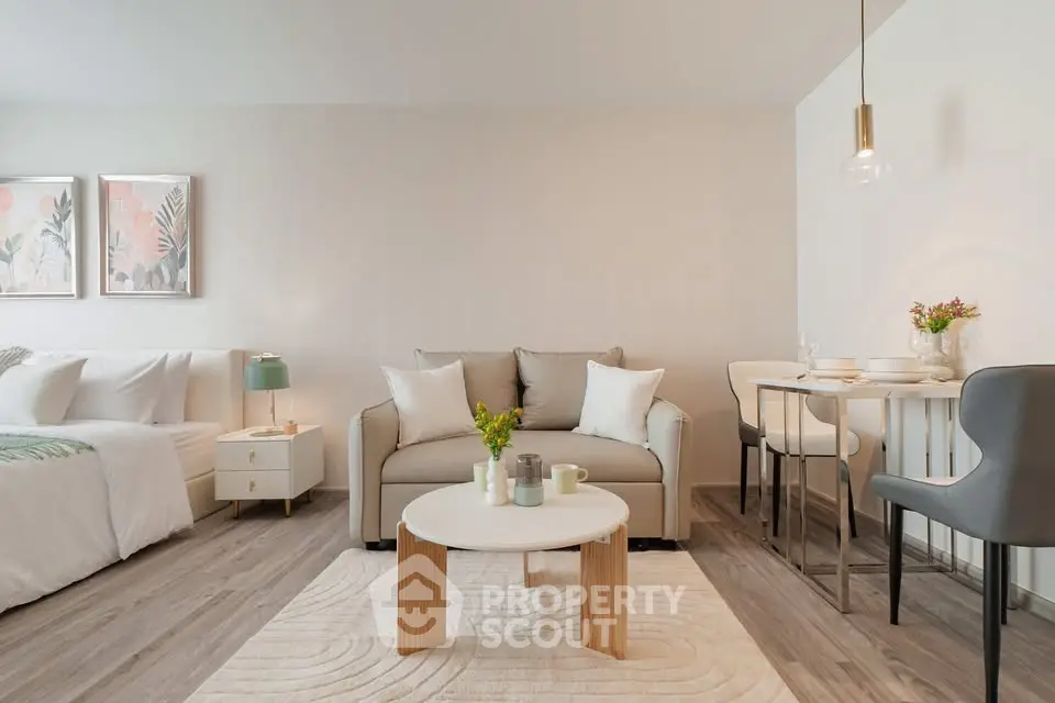 Modern studio apartment with cozy living area and stylish decor