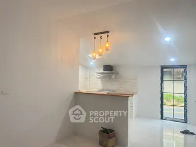 Modern kitchen with open layout and stylish lighting