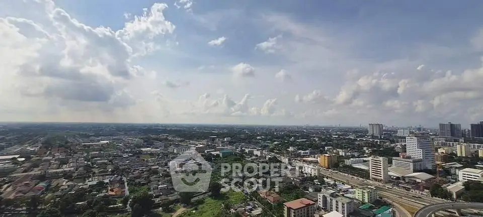 Stunning panoramic cityscape view from high-rise building showcasing urban skyline and expansive horizon.