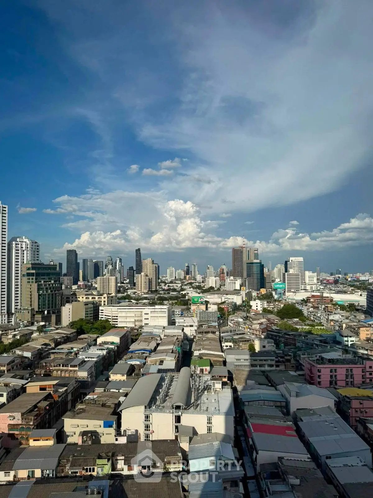 Stunning cityscape view showcasing urban skyline and vibrant architecture under a clear blue sky.