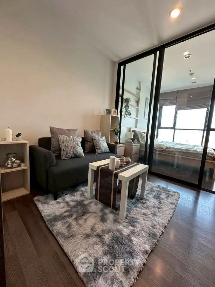 Modern living room with cozy decor and large window view