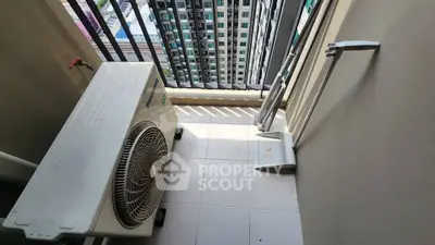 Compact balcony with air conditioning unit and city view in modern apartment