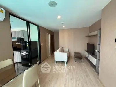 Modern living room with sleek furniture and open layout in a stylish apartment.