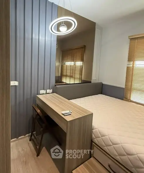 Modern bedroom with stylish lighting and wooden furniture