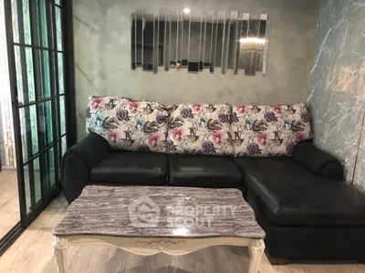 Stylish living room with floral sofa and elegant marble coffee table