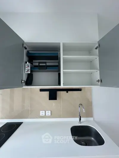 Modern kitchen with sleek cabinetry and integrated appliances