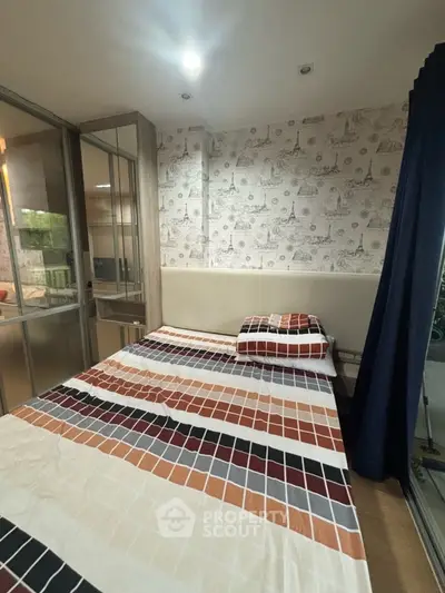 Cozy bedroom with modern decor and large window for natural light