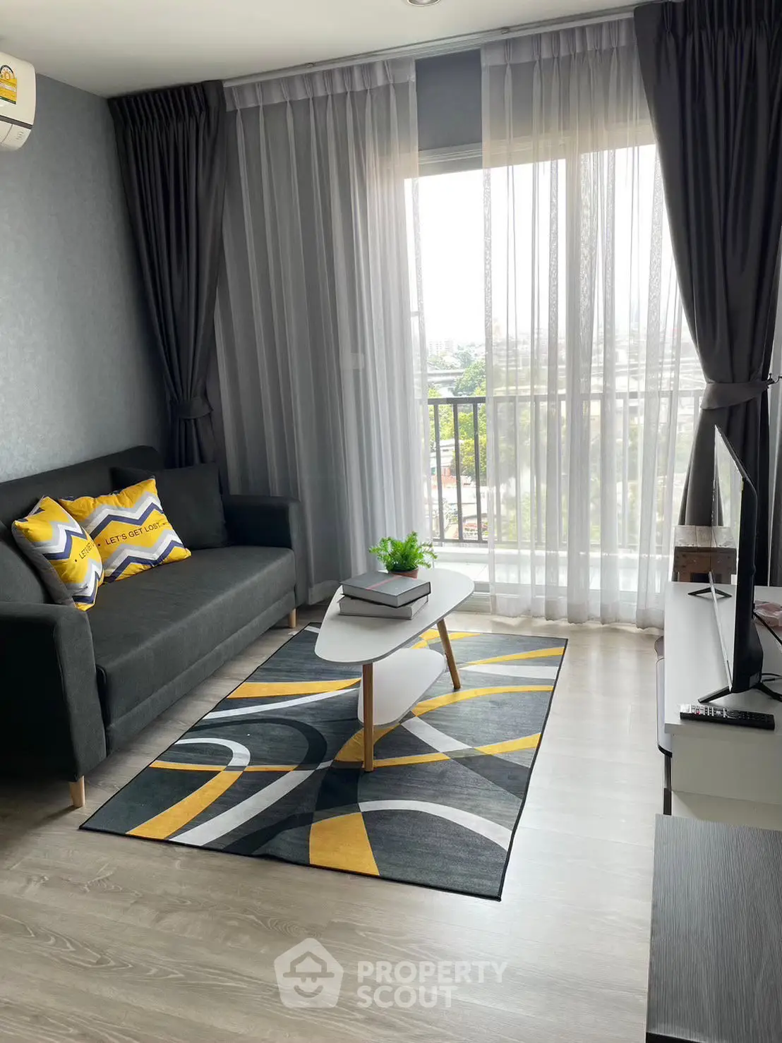 Modern living room with stylish decor and large window view