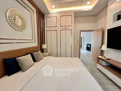 Luxurious modern bedroom with elegant decor and ample storage space
