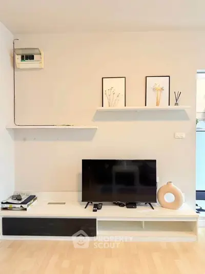 Modern living room with minimalist TV setup and stylish decor