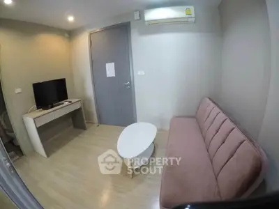 Cozy living room with modern furniture and air conditioning in a stylish apartment.