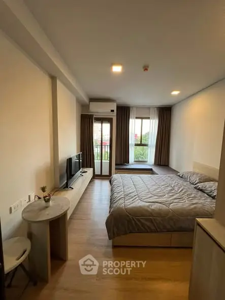 Modern bedroom with balcony access and stylish decor