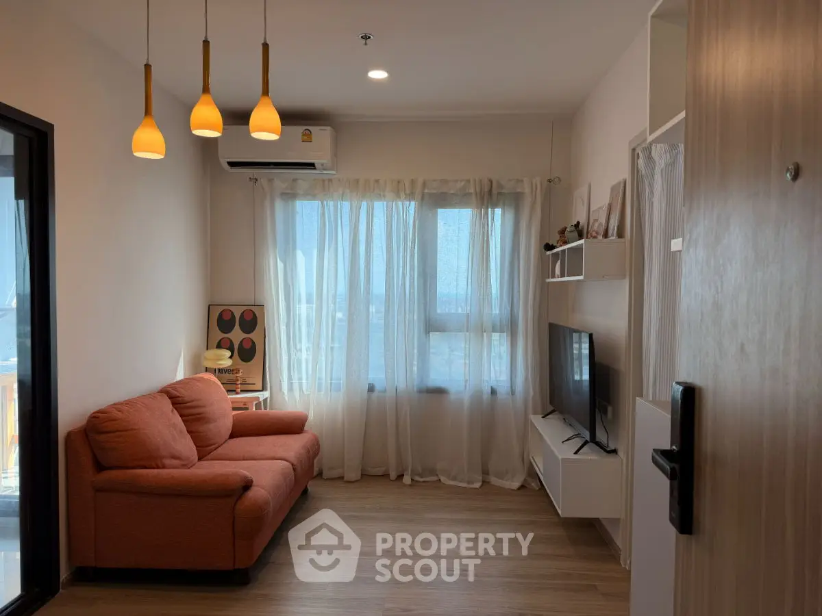 Modern living room with cozy orange sofa and stylish lighting