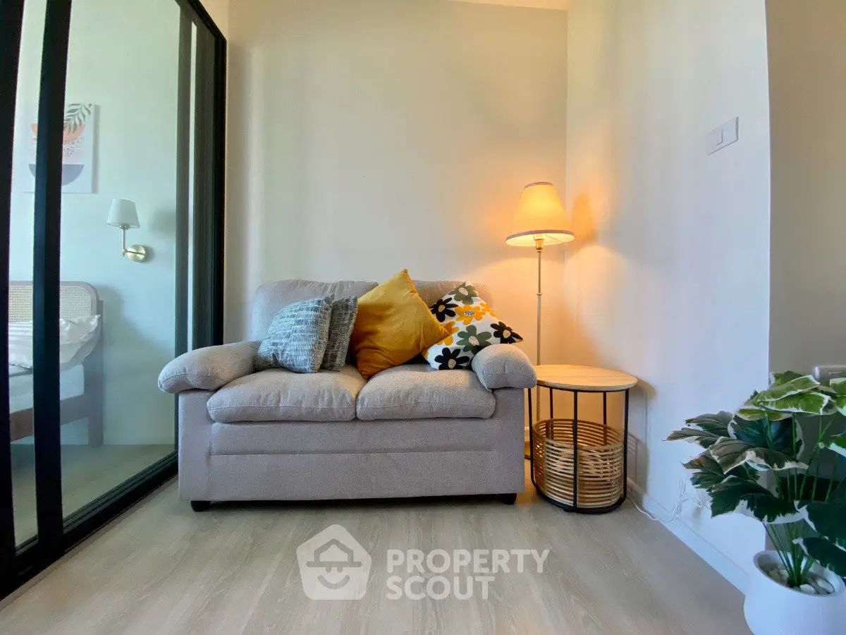 Cozy living room corner with plush armchair and ambient lighting