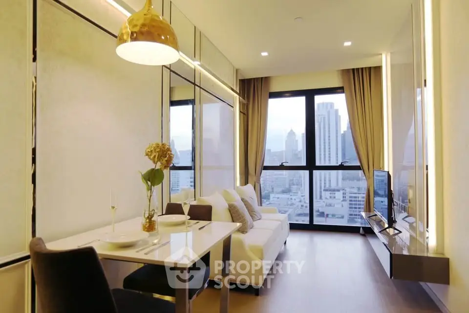 Modern living room with city view, featuring elegant decor and ample natural light.