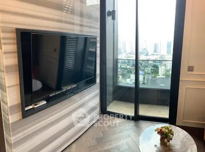 Modern living room with city view balcony and sleek TV setup
