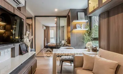 Modern living room with open layout and stylish decor in a contemporary apartment.