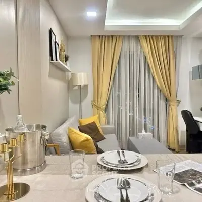 Elegant living room with modern decor and dining setup