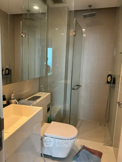 Modern bathroom with glass shower and sleek fixtures