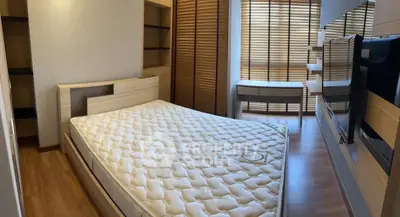 Spacious bedroom with modern design and ample natural light