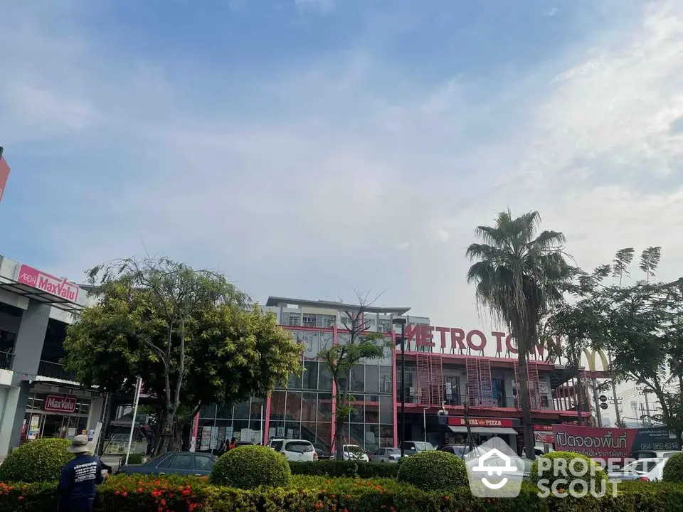 Commercial building with vibrant signage and lush landscaping