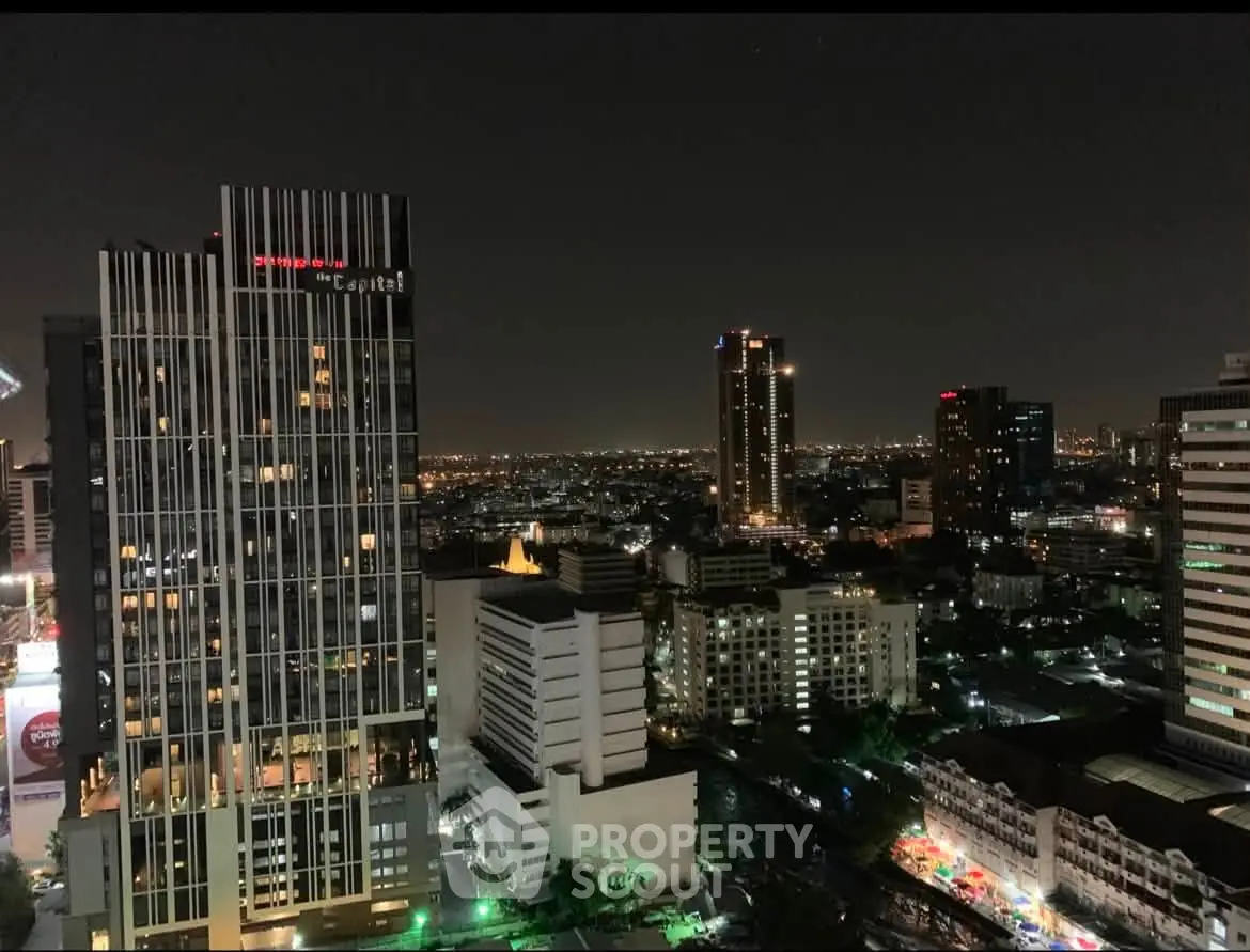 Stunning night view of city skyline with illuminated buildings and vibrant urban landscape.