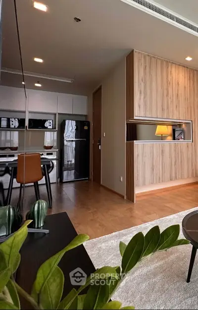 Modern open-plan living room with stylish kitchen and cozy decor