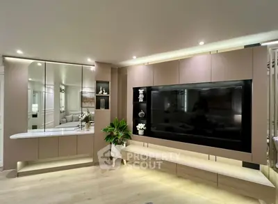 Modern living room with sleek built-in entertainment center and ambient lighting