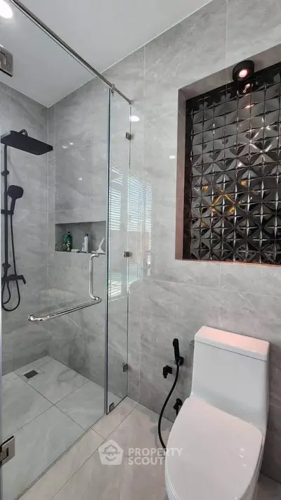 Modern bathroom with sleek glass shower and stylish tile design