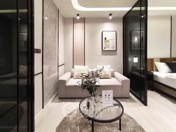 Modern living room with stylish decor and glass partitions