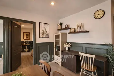 Charming study room with elegant decor and wooden furniture, perfect for a cozy home office setup.