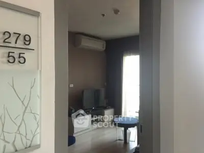 Modern living room with air conditioning and stylish decor in a cozy apartment.