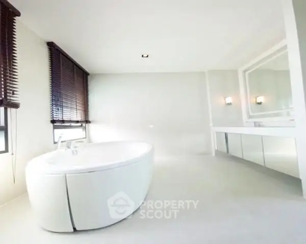 Luxurious bathroom with modern bathtub and elegant blinds