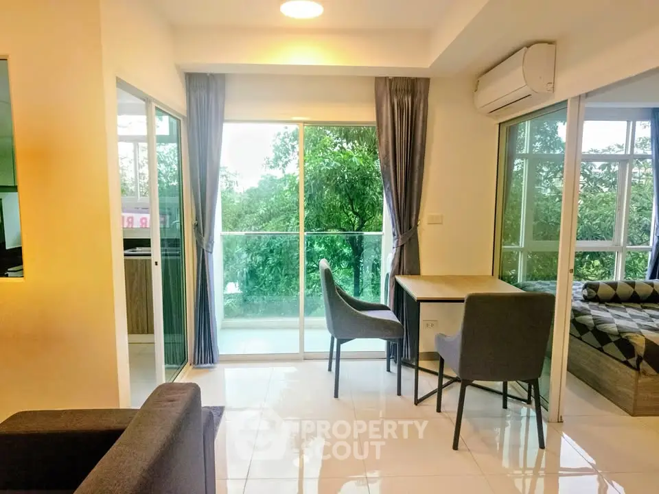 Modern apartment with open living area and balcony view