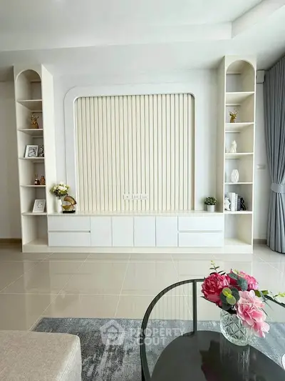 Modern living room with elegant built-in shelving and stylish decor