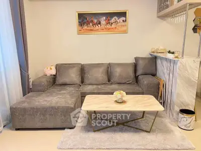 Stylish living room with plush gray sofa and elegant marble coffee table