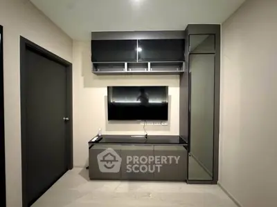 Modern living room with sleek TV unit and storage cabinets