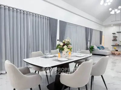 Spacious modern living room with elegant dining area and stylish decor