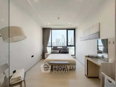 Modern bedroom with city view, featuring sleek furniture and large windows for natural light.