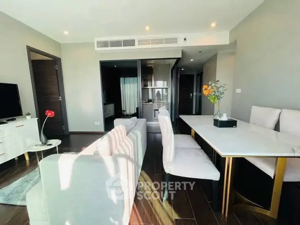 Modern living room with elegant dining area and stylish decor