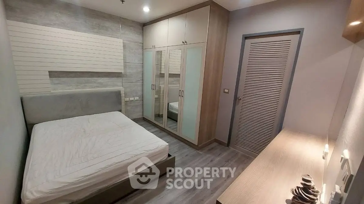 Modern bedroom with sleek design and ample storage space