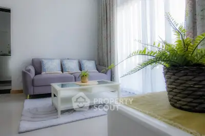 Charming living room with cozy sofa and elegant decor, perfect for relaxation and entertaining guests.