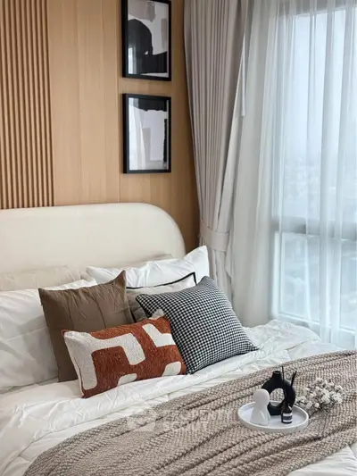 Cozy bedroom with stylish decor and large window view
