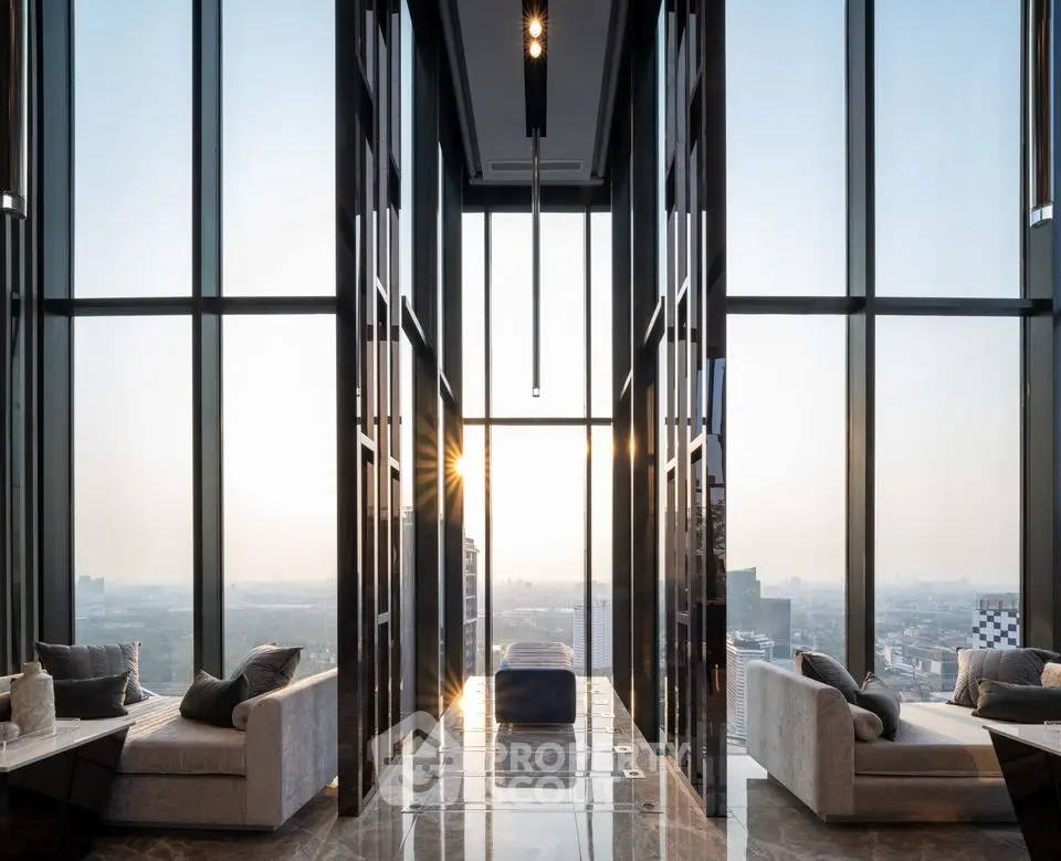 Luxurious high-rise living room with panoramic city views and elegant modern design.