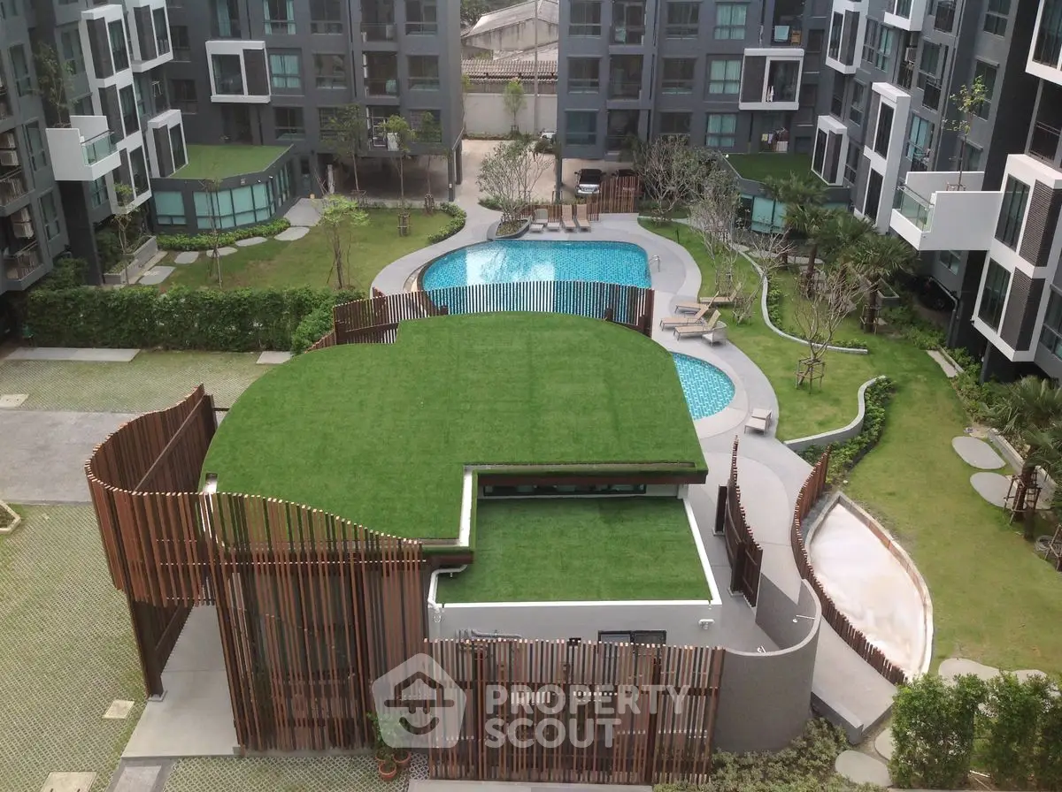 Modern apartment complex with rooftop garden and pool view