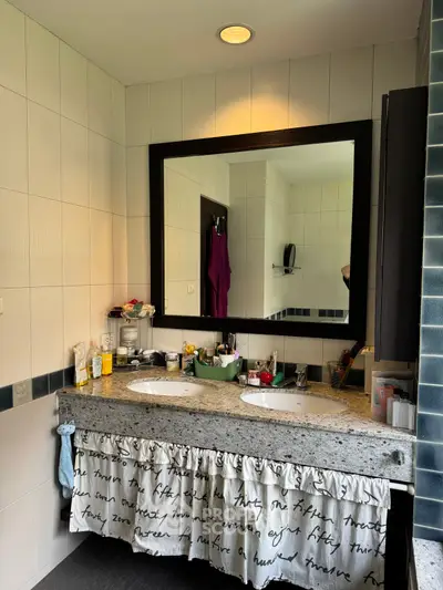 Modern bathroom with dual sinks and stylish mirror