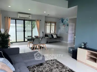 Modern living room with stylish decor and large windows for natural light